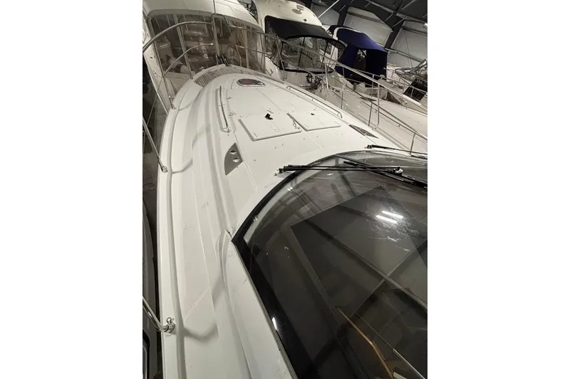 Slide: The Image of 2014 Beneteau Gran Turismo 49 yacht in storage, showcasing sleek design and spacious deck. - 33