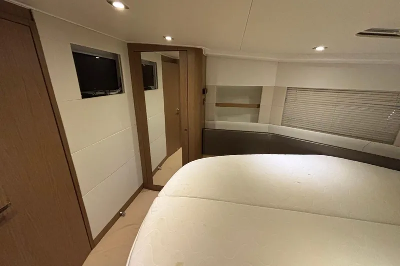 Slide: The Image of Luxurious interior cabin of a 2014 Beneteau Gran Turismo 49 yacht, featuring modern design and cozy bedding. - 44