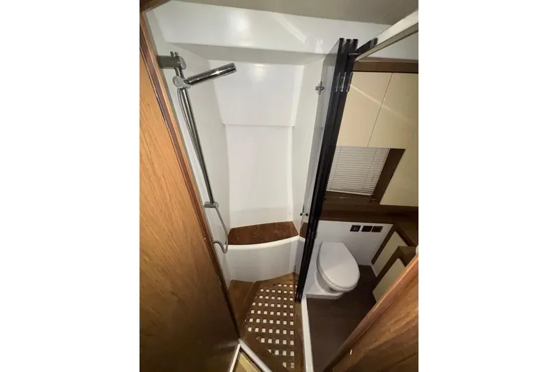 Slide: The Image of Bathroom interior of 2014 Beneteau Gran Turismo 49 yacht, featuring shower and toilet. - 47