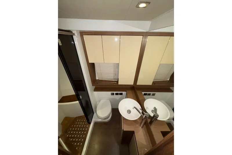 Slide: The Image of Luxurious bathroom in 2014 Beneteau Gran Turismo 49 yacht with dual sinks and modern fixtures. - 48