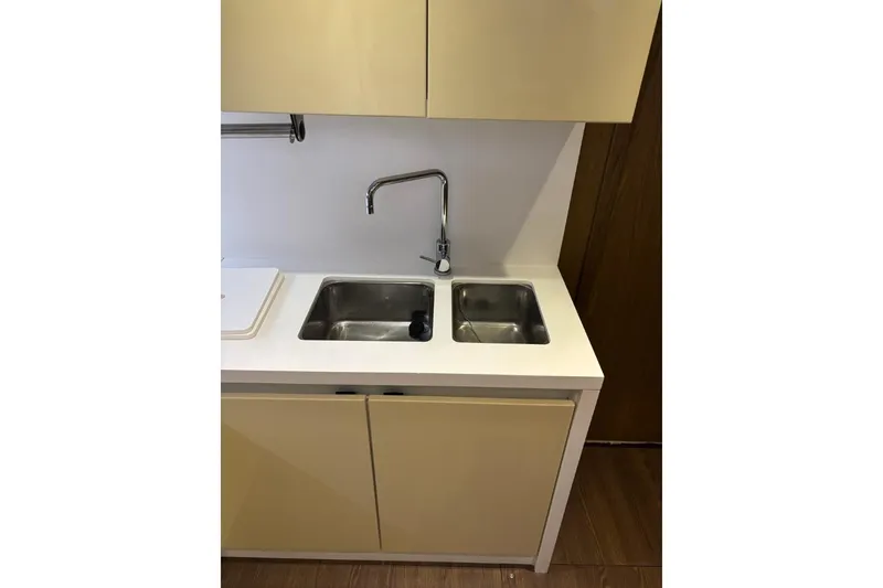 Slide: The Image of Compact kitchen sink area in 2014 Beneteau Gran Turismo 49 yacht. - 53