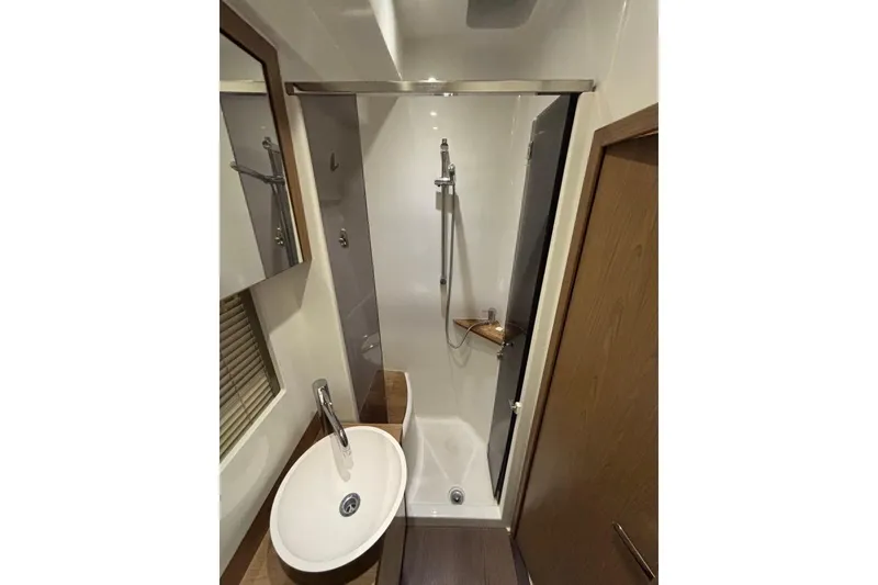Slide: The Image of Bathroom interior of 2014 Beneteau Gran Turismo 49 yacht, featuring shower and sink. - 61