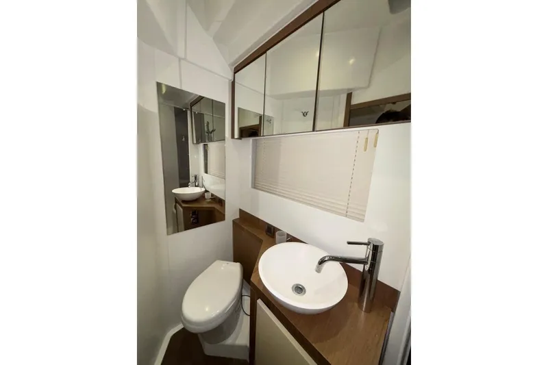 Slide: The Image of Bathroom interior of 2014 Beneteau Gran Turismo 49 yacht, featuring modern sink and toilet. - 63