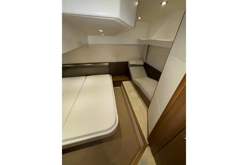 Slide: The Image of 2014 Beneteau Gran Turismo 49 cabin interior with modern furnishings and ambient lighting. - 64