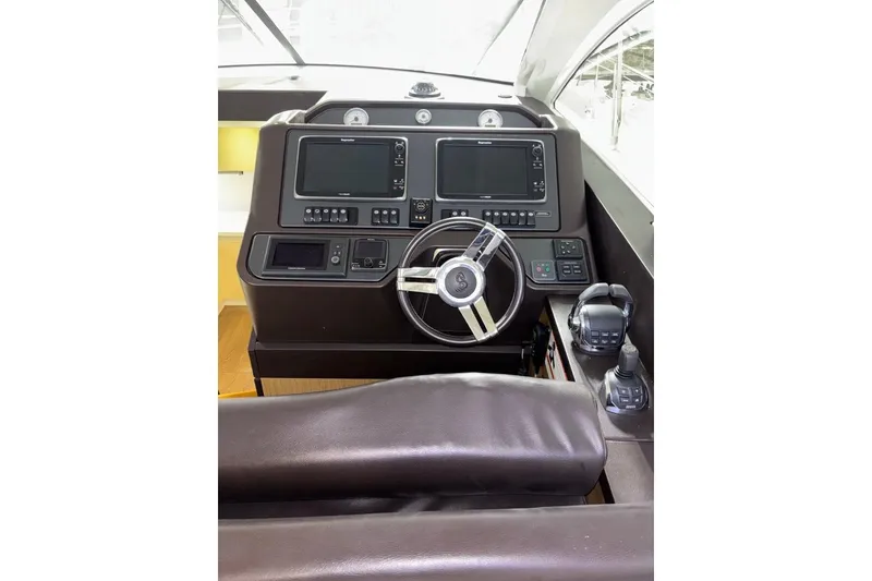 Slide: The Image of 2014 Beneteau Gran Turismo 49 helm with dual screens and leather seating. - 69