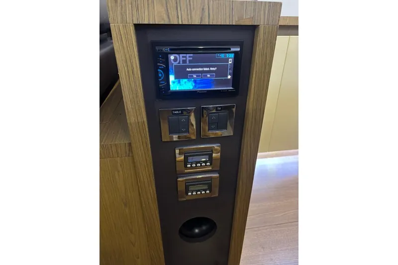 Slide: The Image of Control panel on 2014 Beneteau Gran Turismo 49 yacht with display and switches. - 71