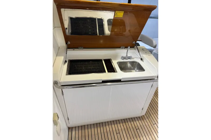 Slide: The Image of Outdoor kitchenette on 2014 Beneteau Gran Turismo 49 yacht with grill and sink. - 8