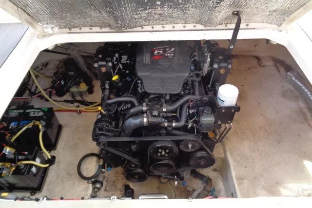 Slide: The Image of Engine compartment of a 2002 Chaparral Signature 260 boat, featuring a MerCruiser engine. - 23