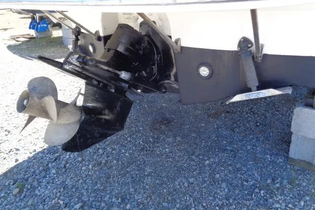 Slide: The Image of 2002 Chaparral Signature 260 boat stern drive and propeller on gravel surface. - 27