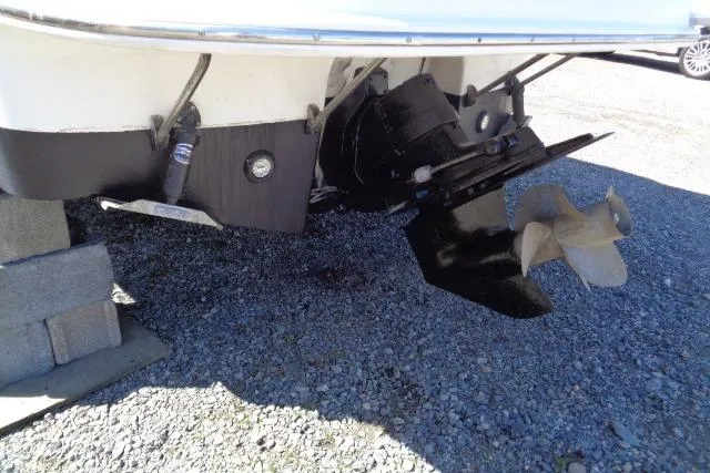 Slide: The Image of 2002 Chaparral Signature 260 boat stern and propeller on gravel surface. - 28