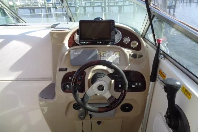 Slide: The Image of Steering console of 2002 Chaparral Signature 260 boat with navigation equipment. - 7