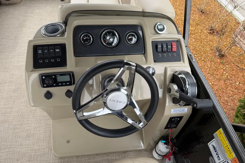 Slide: The Image of Steering console of 2021 Crest Classic LX 200 L pontoon boat with controls and gauges. - 10