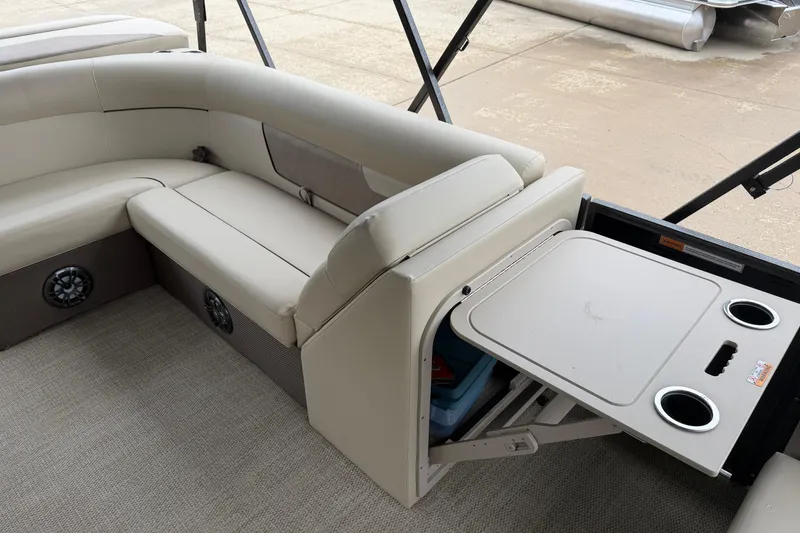 Slide: The Image of Interior of 2021 Crest Classic LX 200 L pontoon boat with seating and fold-out table. - 11