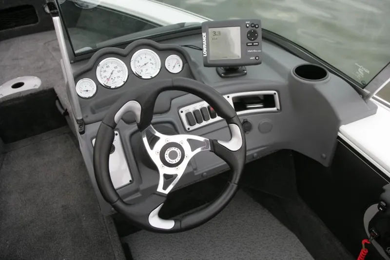 Slide: The Image of Manufacturer Provided Image: 2014 Lund 1875 Crossover XS boat dashboard with steering wheel and gauges. - 10