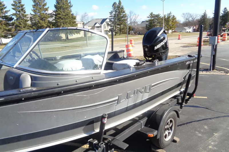 Slide: The Image of 2014 Lund 1875 Crossover XS boat with Mercury engine on trailer. - 2