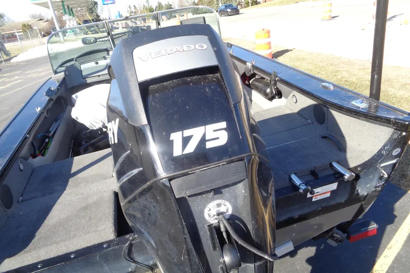 Slide: The Image of 2014 Lund 1875 Crossover XS boat with Mercury 175 Verado engine, parked outdoors. - 6