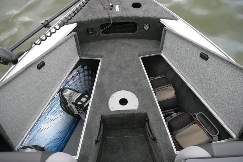 Slide: The Image of Manufacturer Provided Image: 2014 Lund 1875 Crossover XS boat interior storage compartments. - 9