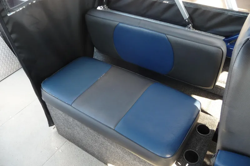 Slide: The Image of 2013 Thunder Jet 21 Luxor OB boat interior seating with blue and gray upholstery. - 10