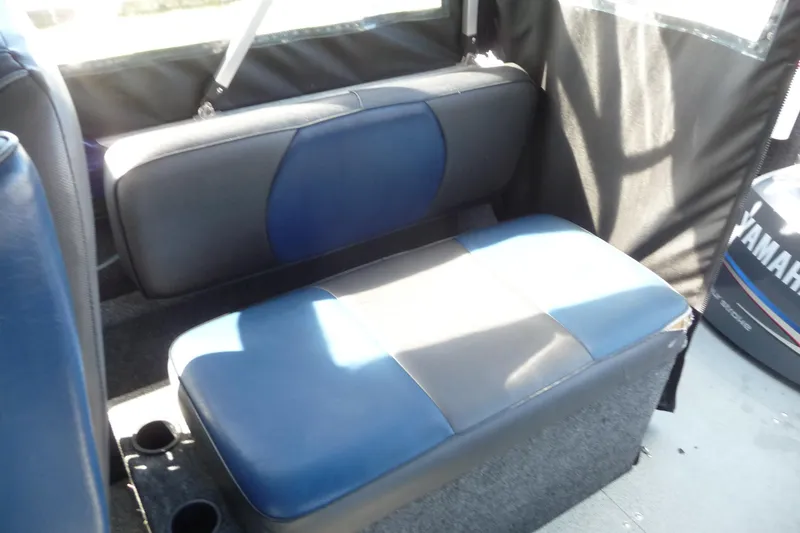 Slide: The Image of Interior seating of 2013 Thunder Jet 21 Luxor OB boat with blue and black upholstery. - 11