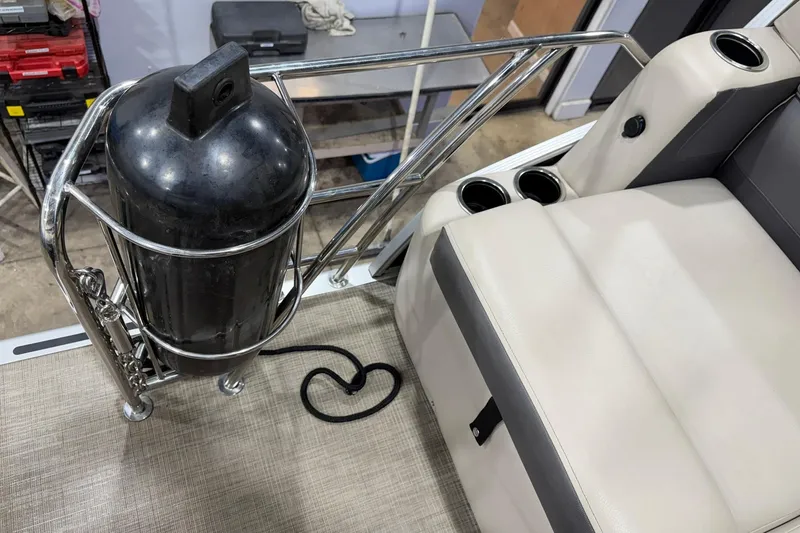 Slide: The Image of 2021 Harris Cruiser 210 boat interior with seating and metal railing. - 14