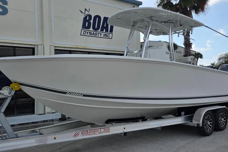 Slide: The Image of 2014 Jupiter 26 FS boat on trailer outside Boat Dynasty Inc. - 1
