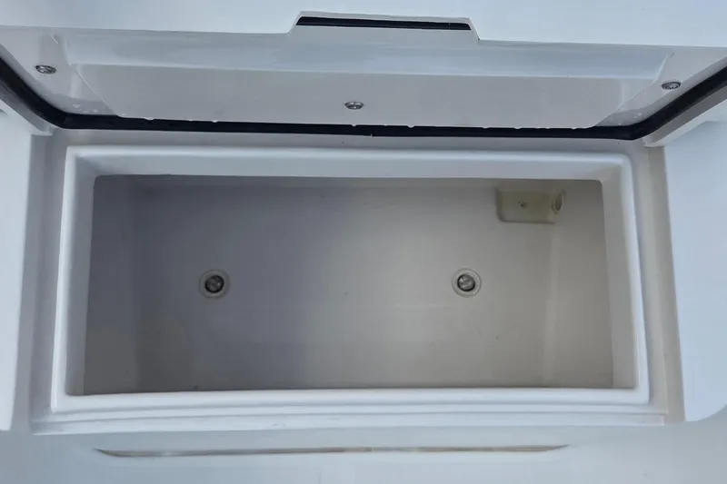 Slide: The Image of Open storage compartment on a 2014 Jupiter 26 FS boat. - 12