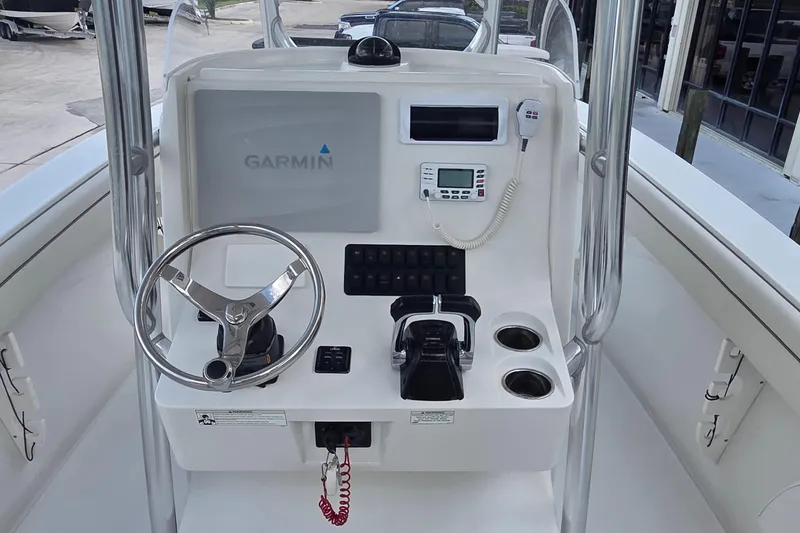 Slide: The Image of Control panel of a 2014 Jupiter 26 FS boat with Garmin navigation system. - 18