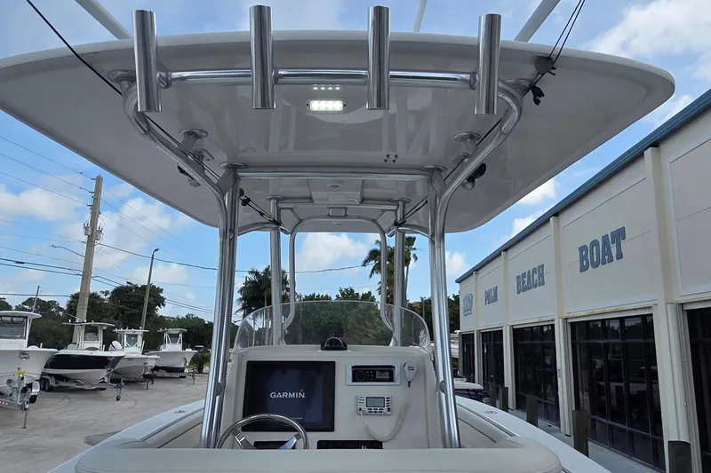 Slide: The Image of 2014 Jupiter 26 FS boat with Garmin navigation, docked at Palm Beach Boat dealership. - 21