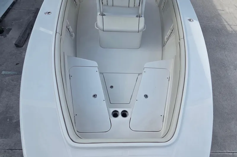 Slide: The Image of 2014 Jupiter 26 FS boat interior with seating and storage compartments. - 7