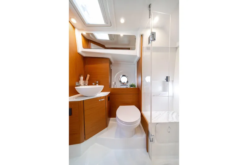 Slide: The Image of Luxurious bathroom in 2026 Beneteau Swift Trawler 37 Fly yacht, featuring modern fixtures and wood accents. - 15