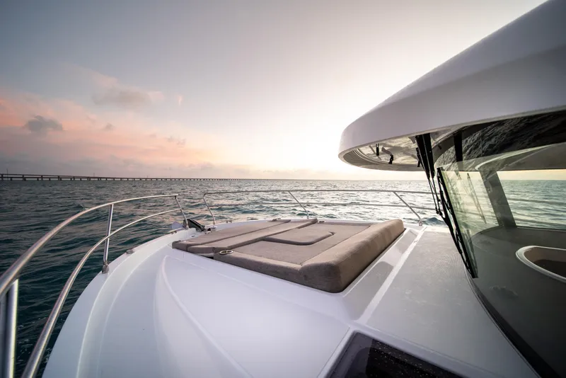 Slide: The Image of 2026 Beneteau Swift Trawler 37 Fly cruising at sunset on open water. - 22