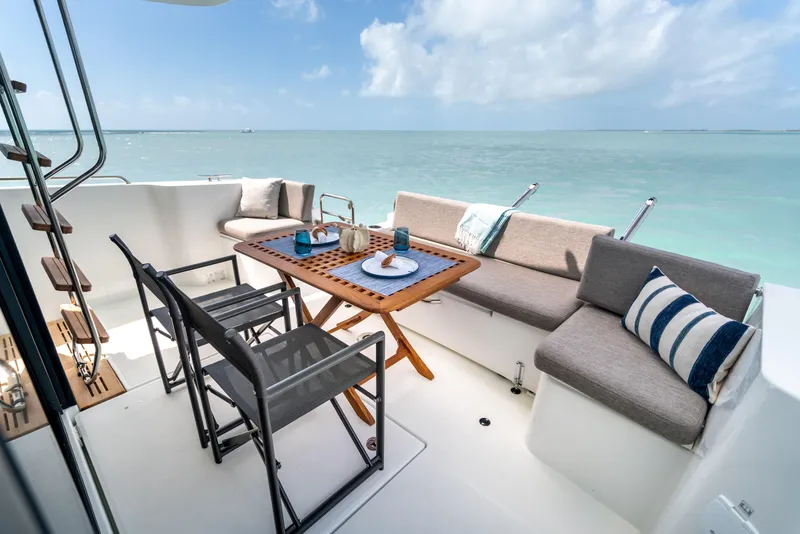 Slide: The Image of 2026 Beneteau Swift Trawler 37 Fly deck with seating and ocean view. - 25