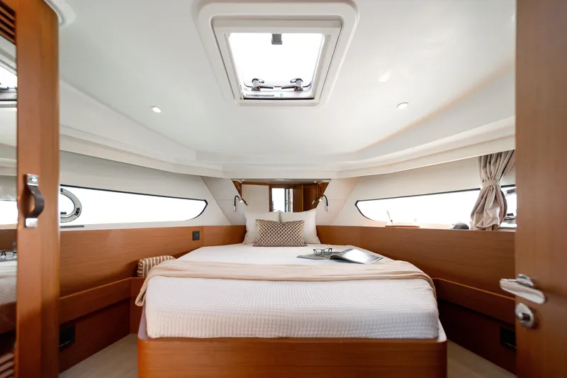 Slide: The Image of Luxurious cabin interior of 2026 Beneteau Swift Trawler 37 Fly with cozy bedding. - 12