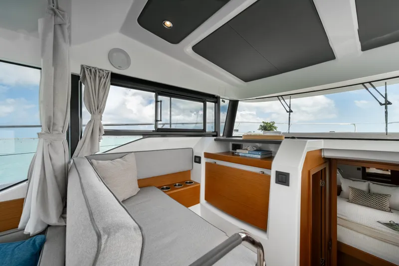 Slide: The Image of Interior of 2026 Beneteau Swift Trawler 37 Fly, featuring modern kitchen and dining area. - 6