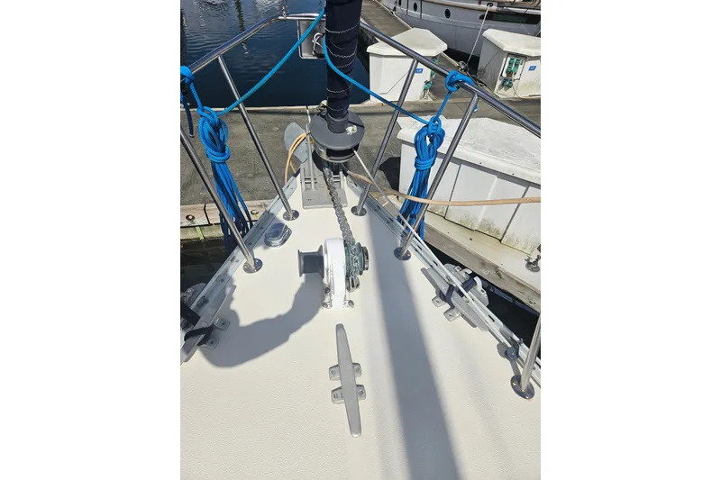Slide: The Image of Bow of 1987 Morgan Classic 41 Center Cockpit sailboat with anchor chain and ropes. - 11