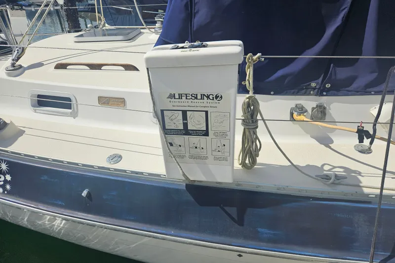 Slide: The Image of 1987 Morgan Classic 41 Center Cockpit with Lifesling2 rescue system on deck. - 12