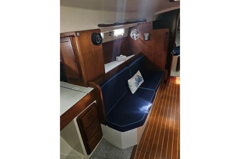 Slide: The Image of Interior of 1987 Morgan Classic 41 Center Cockpit with wooden finish and blue seating. - 18