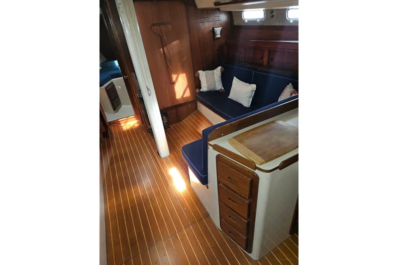 Slide: The Image of Interior of 1987 Morgan Classic 41 Center Cockpit with wooden flooring and cozy seating. - 20