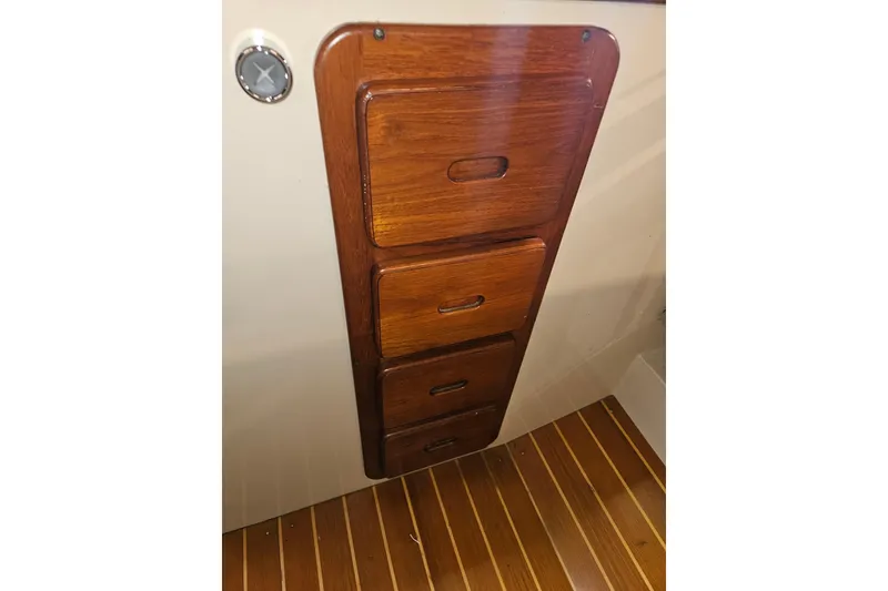 Slide: The Image of Wooden drawers in 1987 Morgan Classic 41 Center Cockpit, featuring sleek design and craftsmanship. - 28