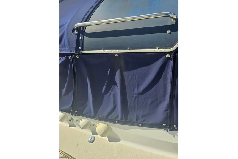 Slide: The Image of 1987 Morgan Classic 41 Center Cockpit with blue canvas cover and stainless steel railing. - 3