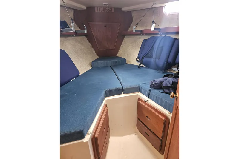 Slide: The Image of Interior cabin of 1987 Morgan Classic 41 Center Cockpit sailboat with blue cushions. - 38