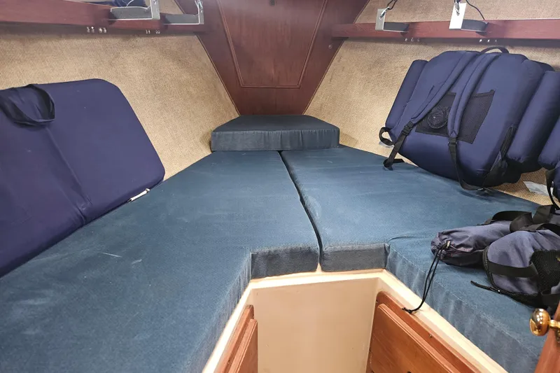 Slide: The Image of Interior cabin of 1987 Morgan Classic 41 Center Cockpit with blue cushions and storage. - 39