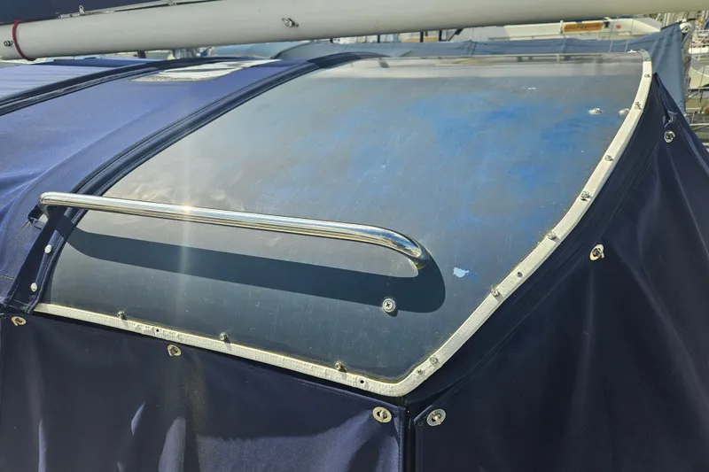 Slide: The Image of 1987 Morgan Classic 41 Center Cockpit with blue canvas cover and stainless steel railing. - 4