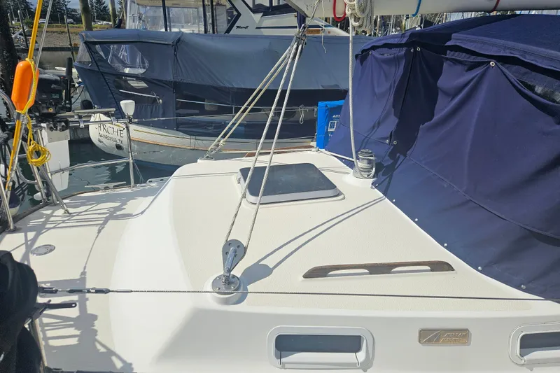 Slide: The Image of 1987 Morgan Classic 41 Center Cockpit sailboat docked, featuring deck and rigging details. - 5