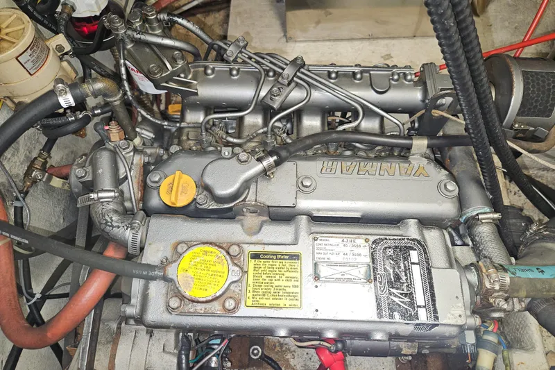 Slide: The Image of Engine of a 1987 Morgan Classic 41 Center Cockpit sailboat, featuring Yanmar components. - 54