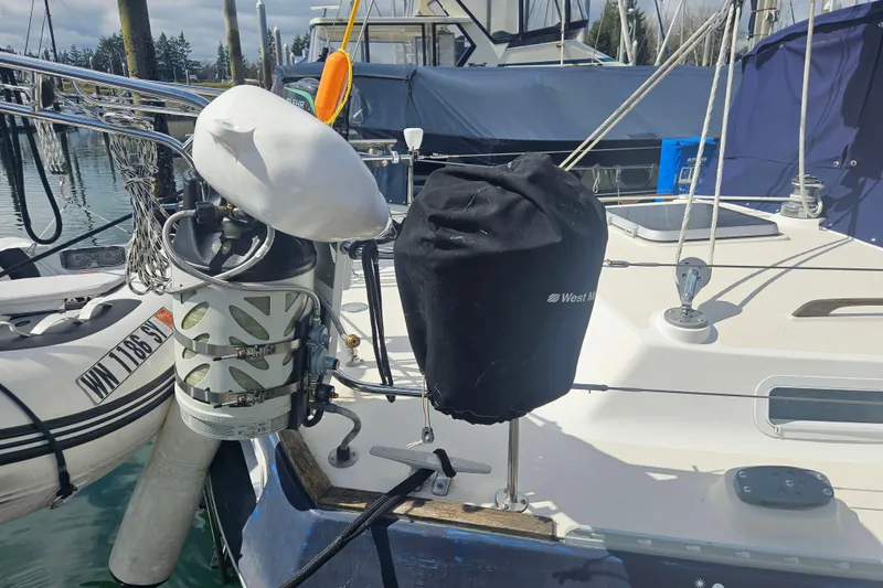 Slide: The Image of 1987 Morgan Classic 41 Center Cockpit sailboat with covered equipment at marina. - 56