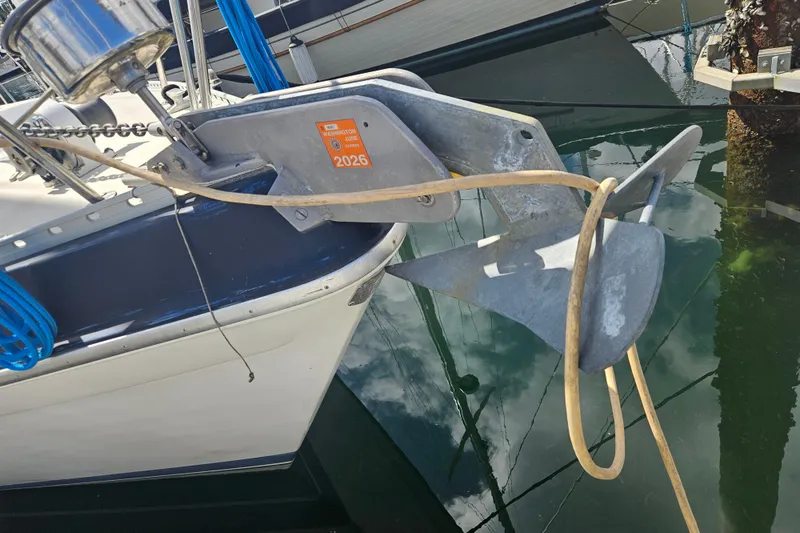 Slide: The Image of Anchor of 1987 Morgan Classic 41 Center Cockpit yacht, docked with visible registration sticker. - 59