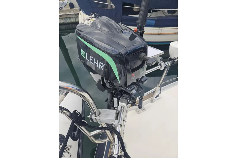 Slide: The Image of Outboard motor on 1987 Morgan Classic 41 Center Cockpit sailboat at marina. - 62