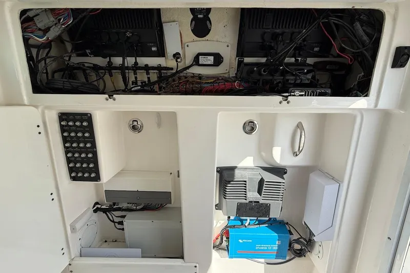 Slide: The Image of 2017 Everglades 355 Center Console electrical panel with wiring and components. - 13
