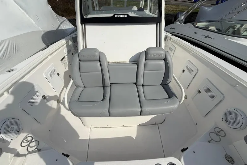 Slide: The Image of 2017 Everglades 355 Center Console boat interior with gray seating and storage compartments. - 14